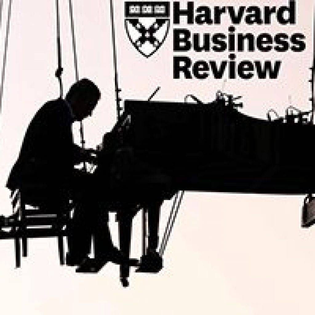 man planning piano with harvard business review logo