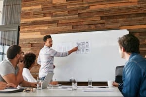 young professional talking to white board