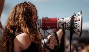 activist standing with megaphone