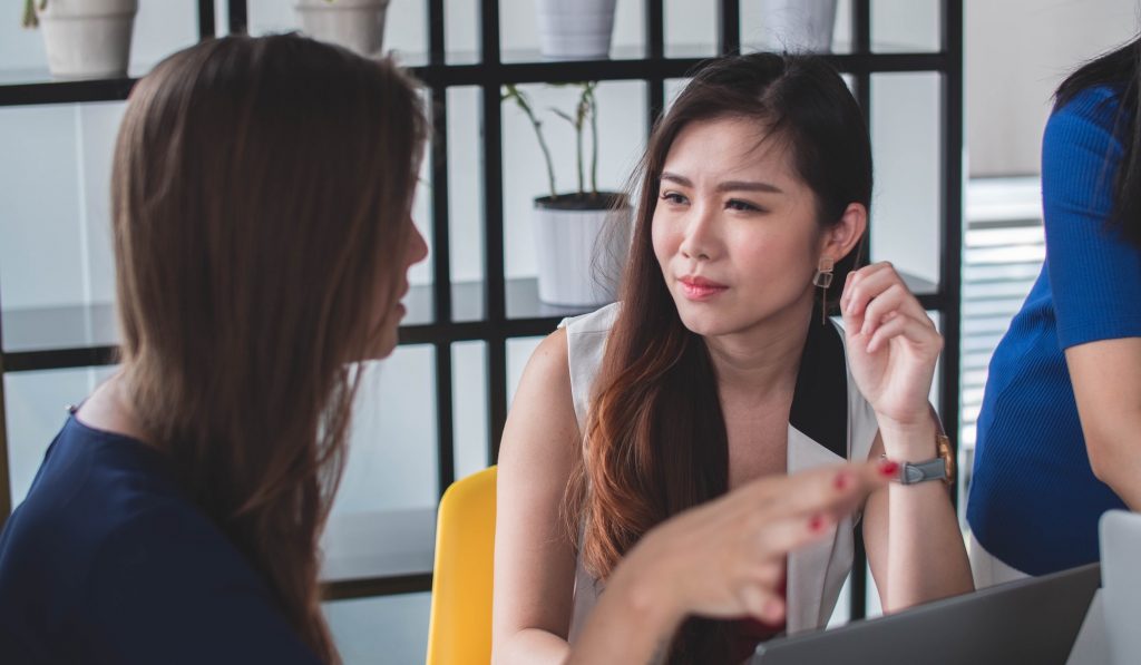 woman listening intently to coworker