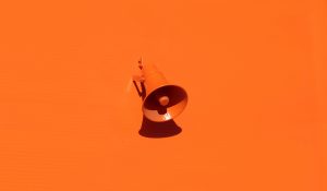orange megaphone against orange background