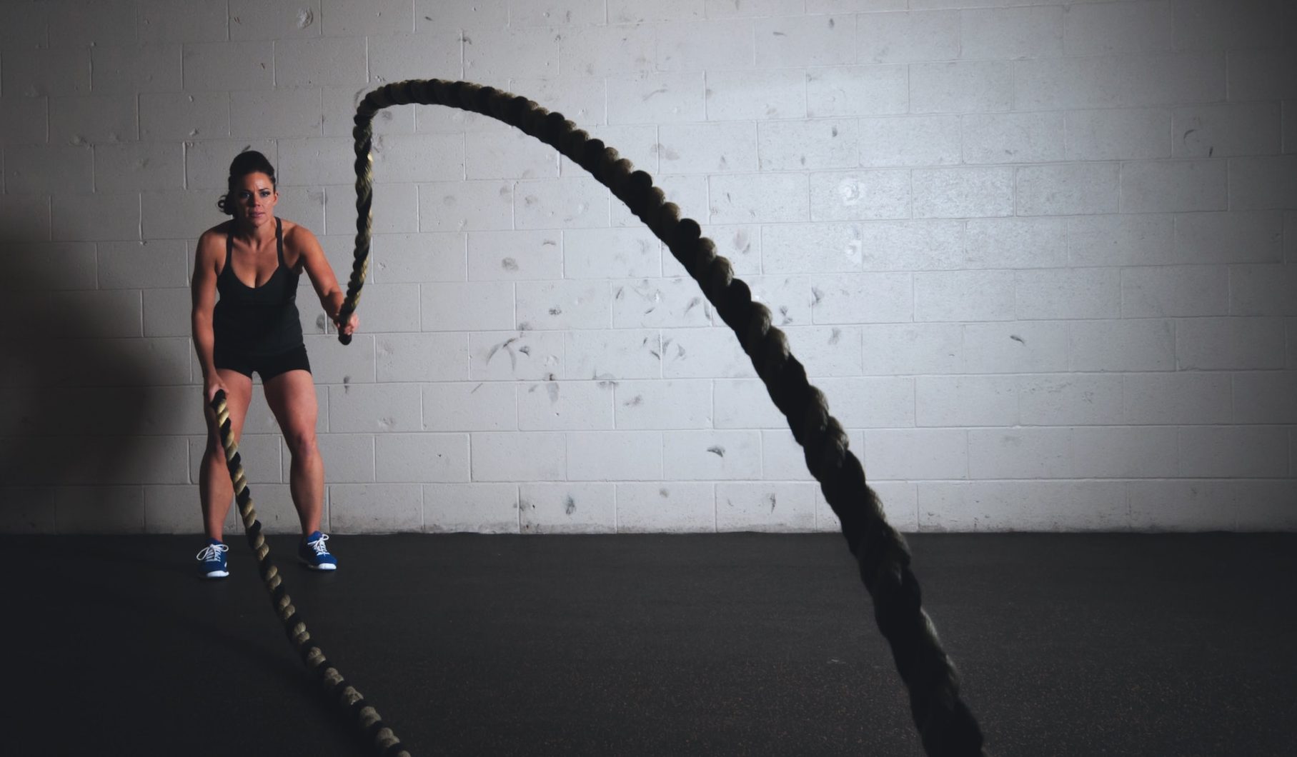 woman training with weighted ropes