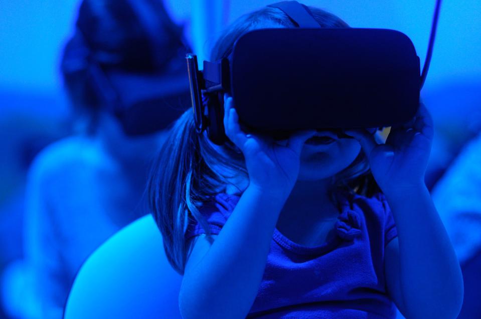 child wearing VR goggles