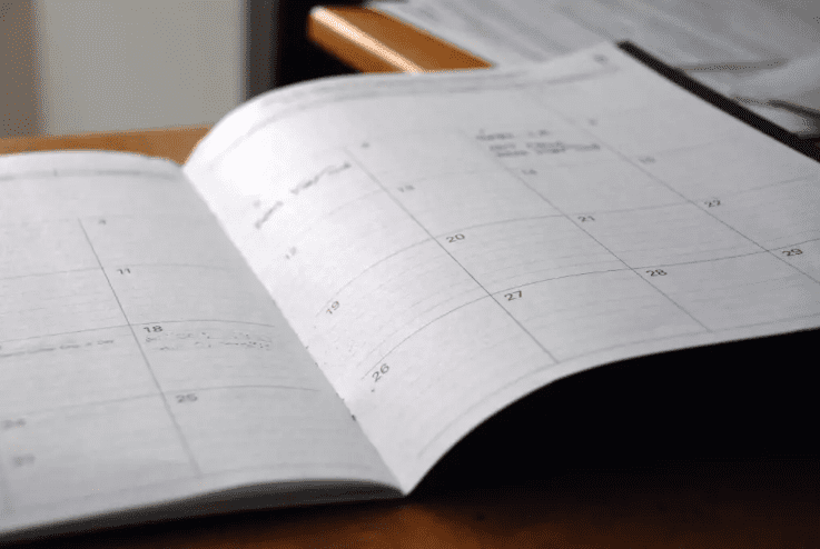 An open calendar is displayed on a desk