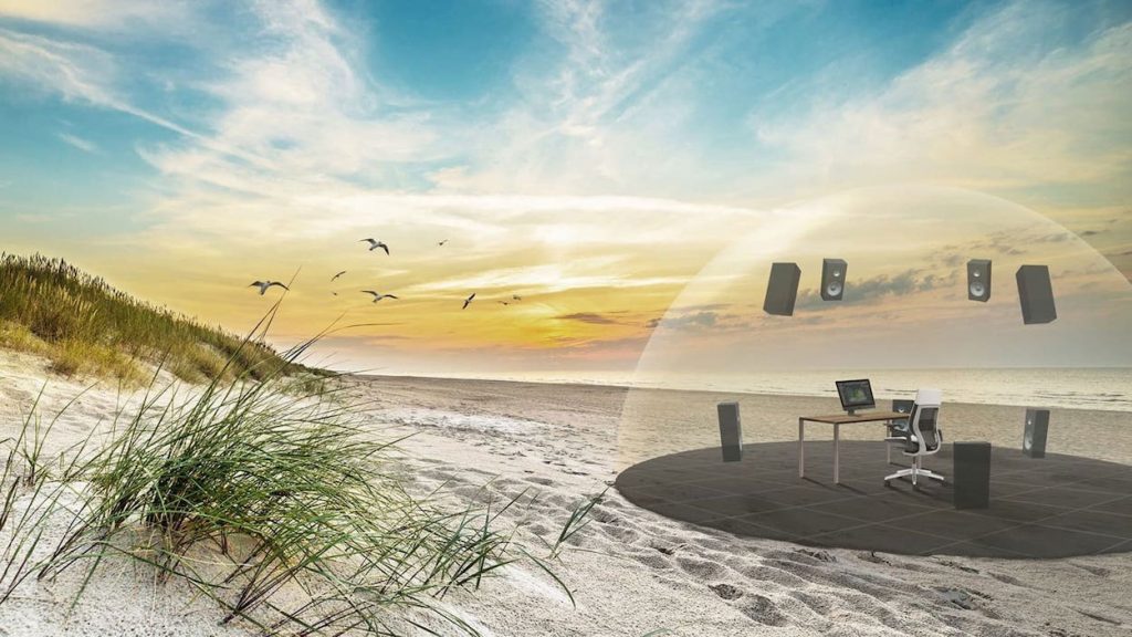 An illustration of a personal workspace on the beach in a dome. Within it are speakers surrounding a desk.