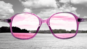 image of rose colored glasses making a black and white scene colorful