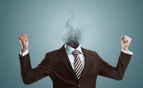 A business man's arms cheer as his head is missing and covered by smoke