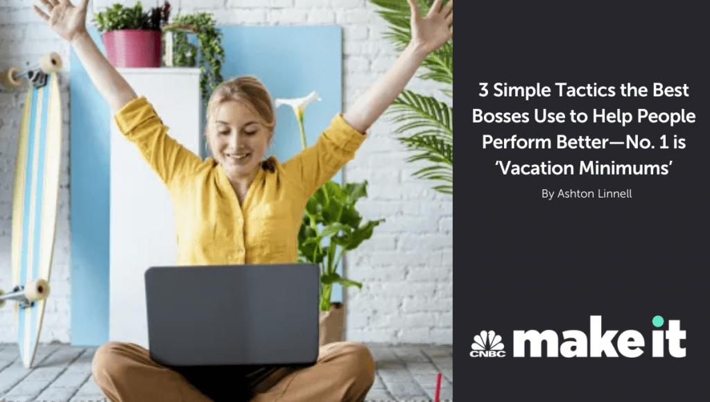 A woman throws her hands in the air with excitement while looking at her laptop.